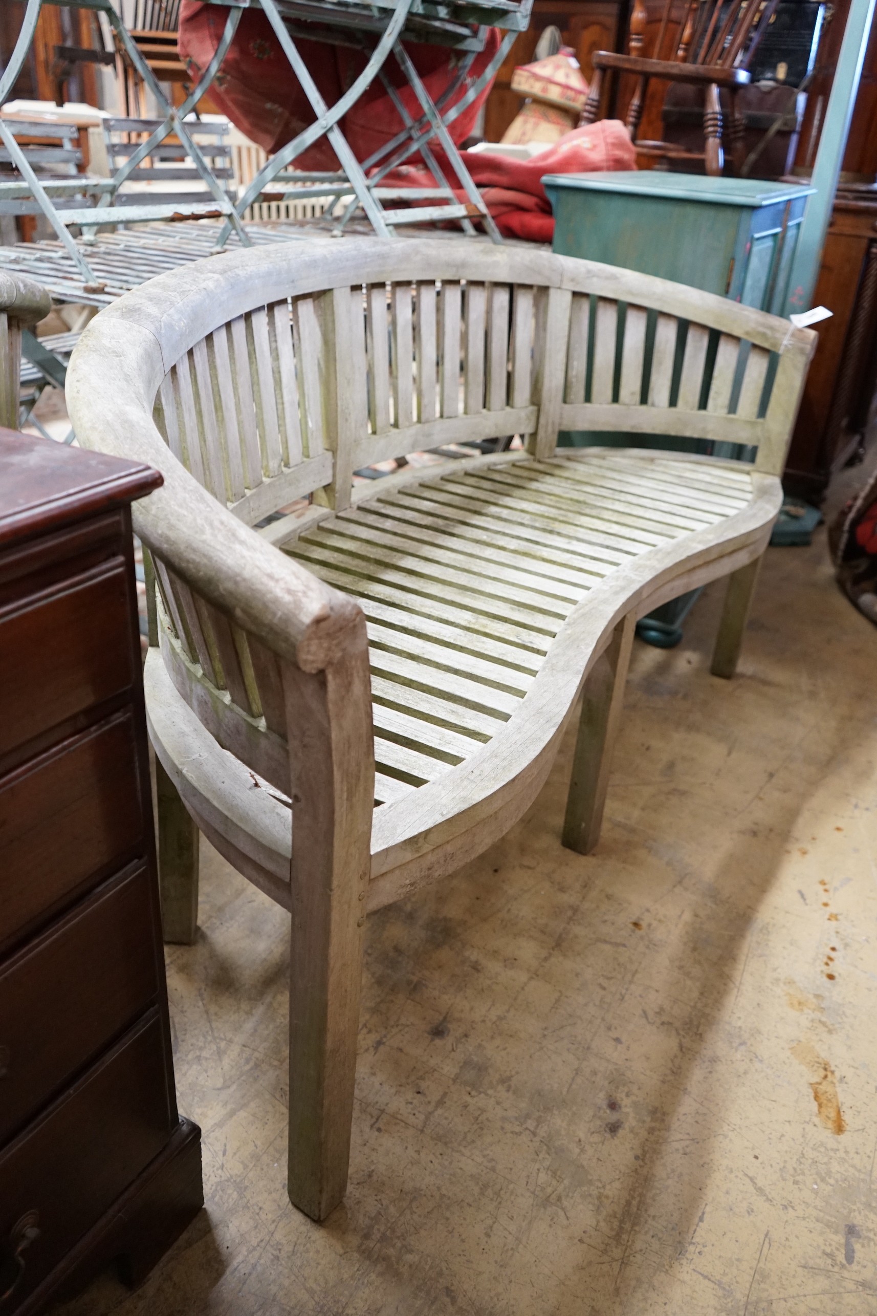 A weathered teak garden banana bench, length 160cm, height 84cm